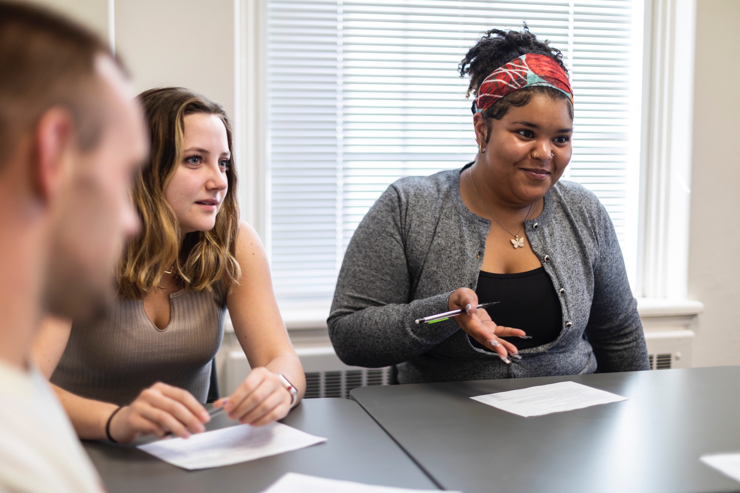 Greensboro College students sitting in class collaborating.