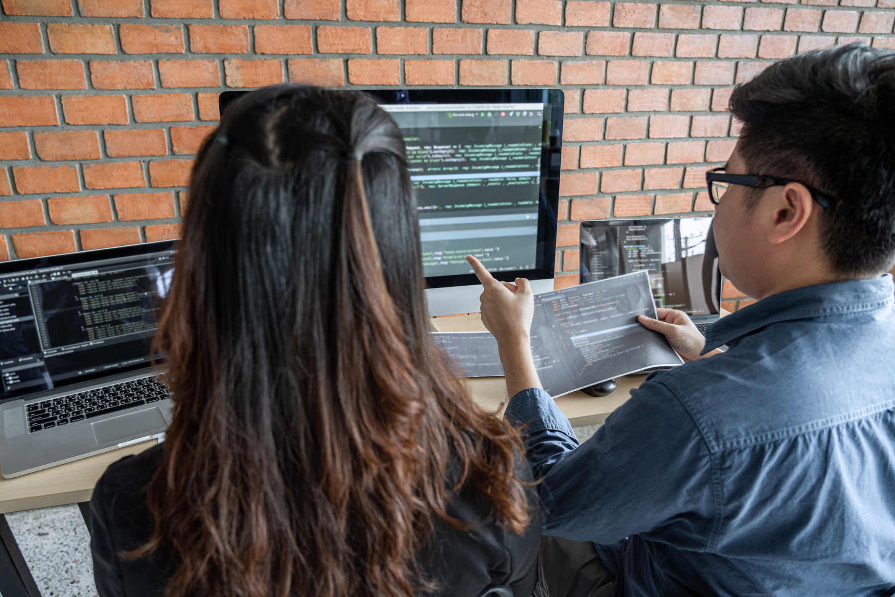 Greensboro College Data Science Major students looking at code on computer screen