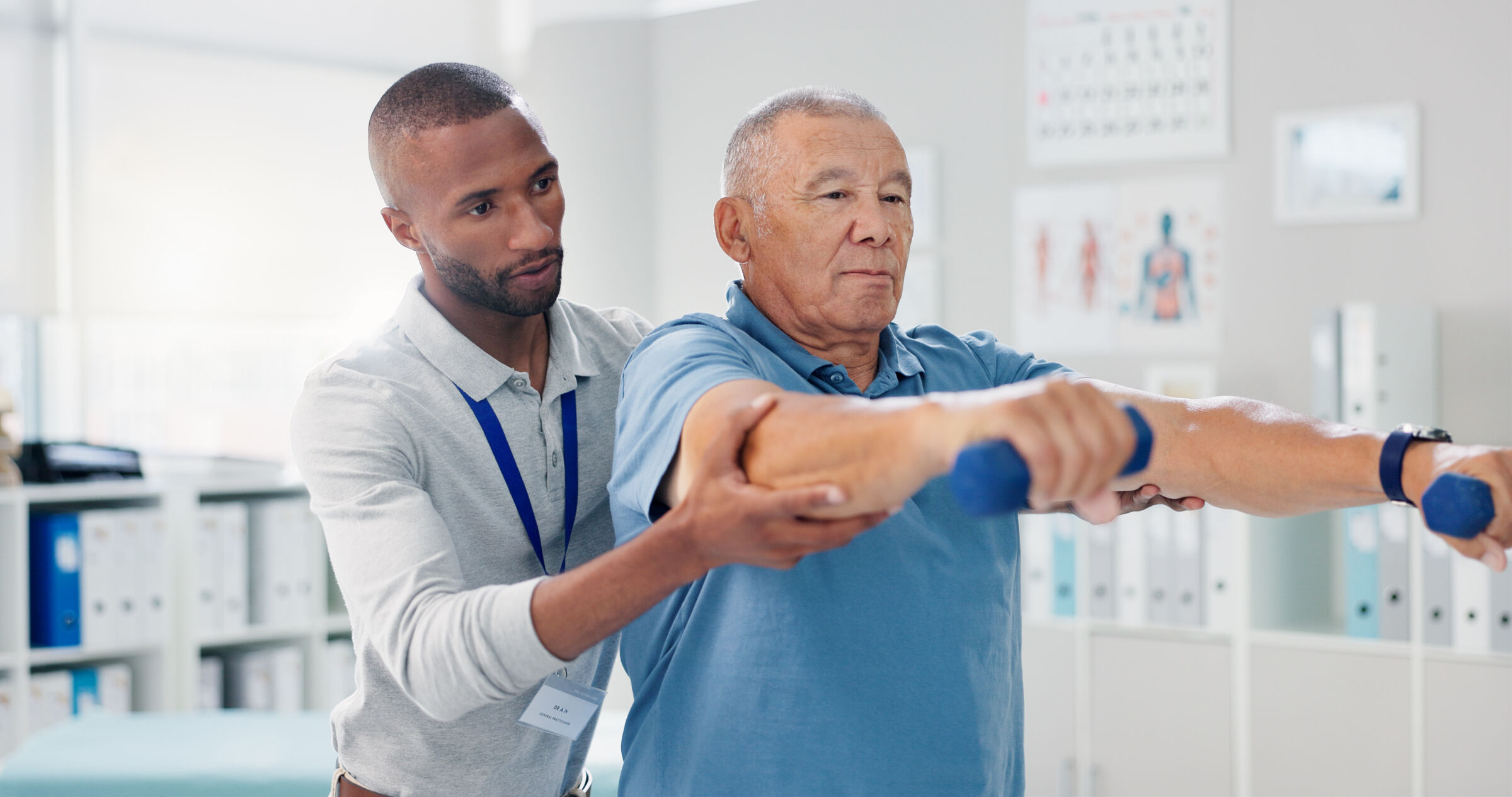 Physical therapist works with patient