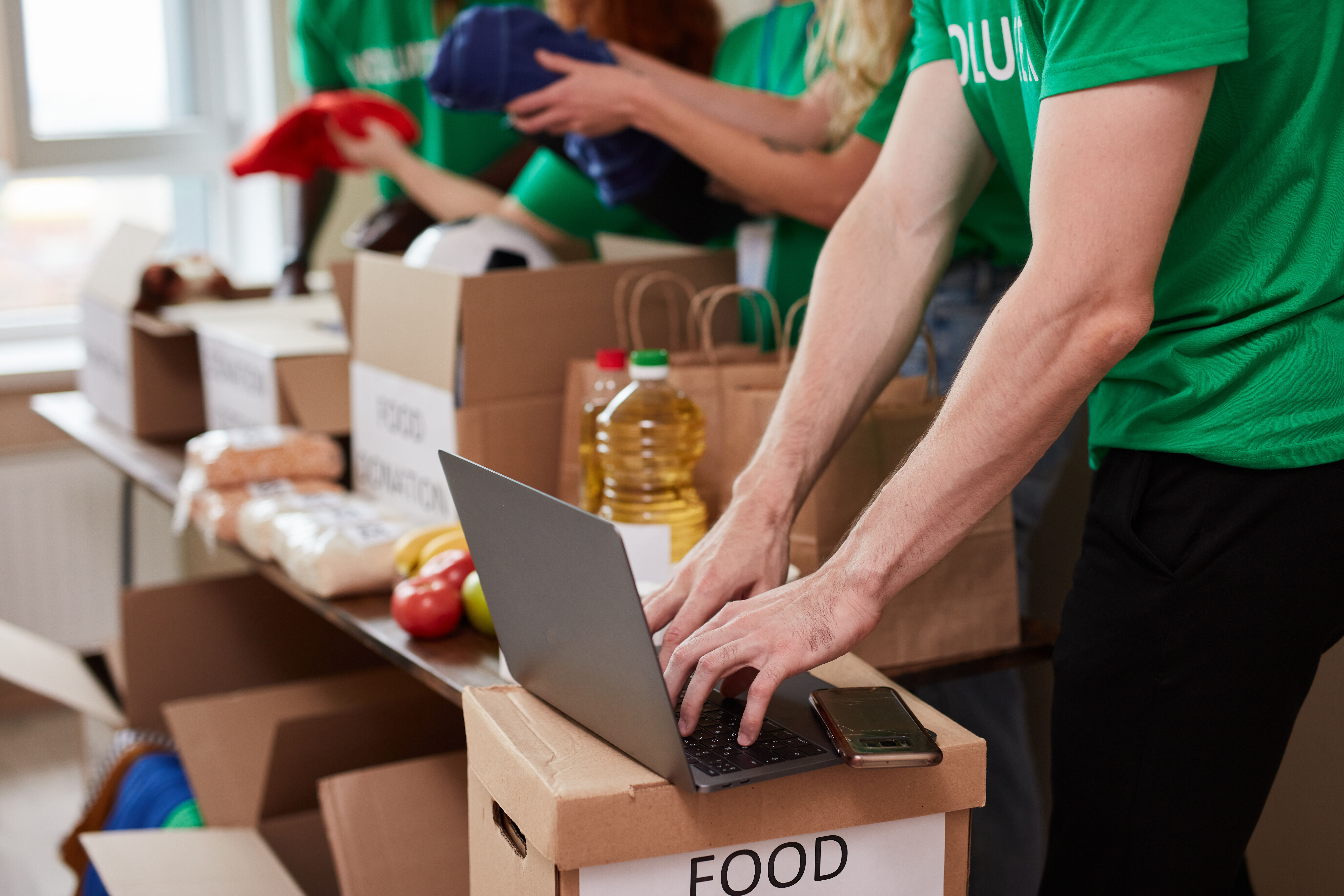 Volunteers organizing donations for charity.
