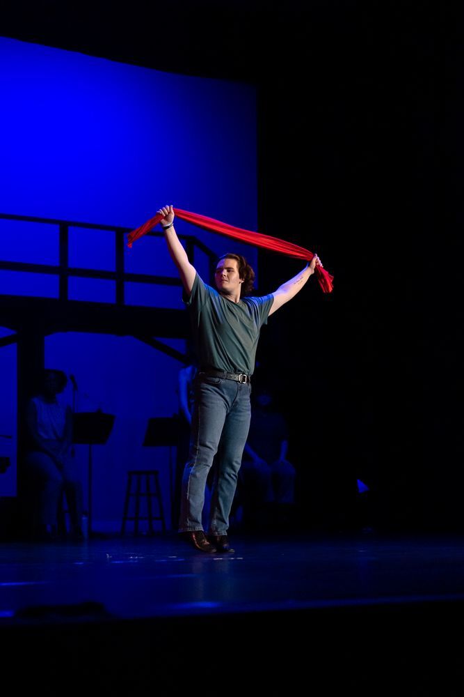 Greensboro College student on stage in theatrical production.